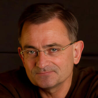 Eddie Hobbs Eddie Hobbs seated with arms folded resting on a chair